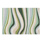 Rug with wavy pattern in green, beige, and blue on a white background