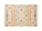 Decorative jute rug with geometric pattern on a white background