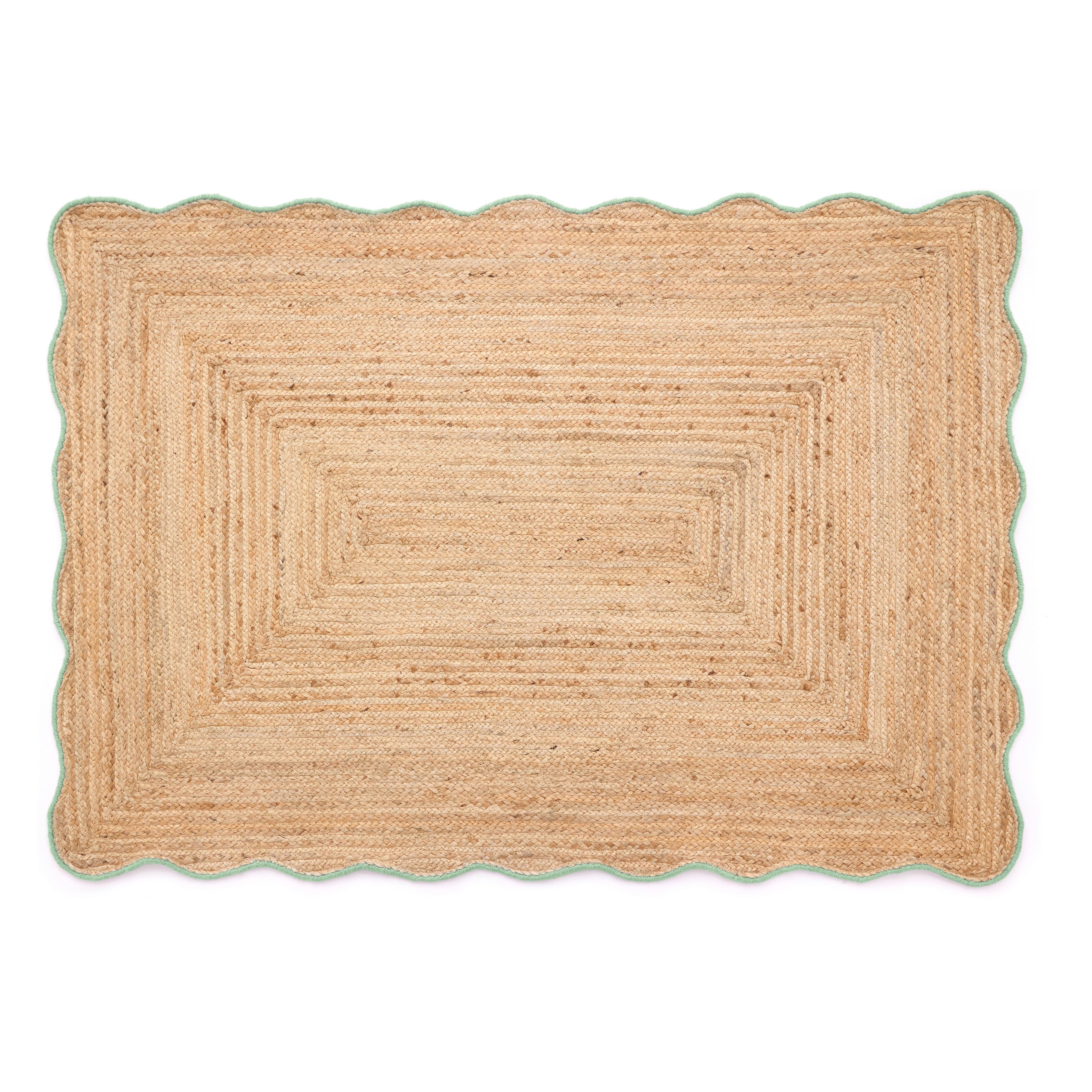 Beige braided rug on a white background