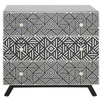 Three-drawer dresser with geometric black and white pattern on a white background