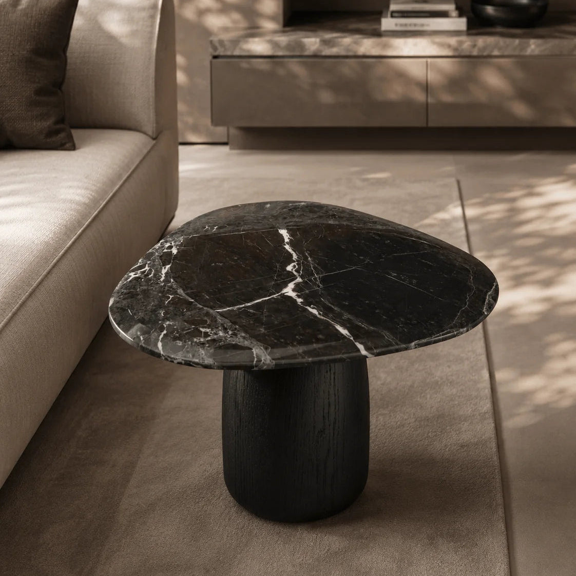 Black marble coffee table in a modern living room setting