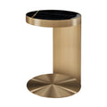 Brass side table with black marble top on a white background