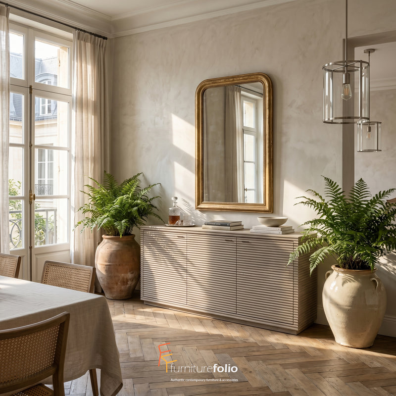 Wickham Oak Sideboard in a dining room with a large mirror, potted plants, and a table.