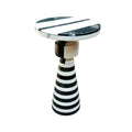 Side table with black and white striped design on a white background